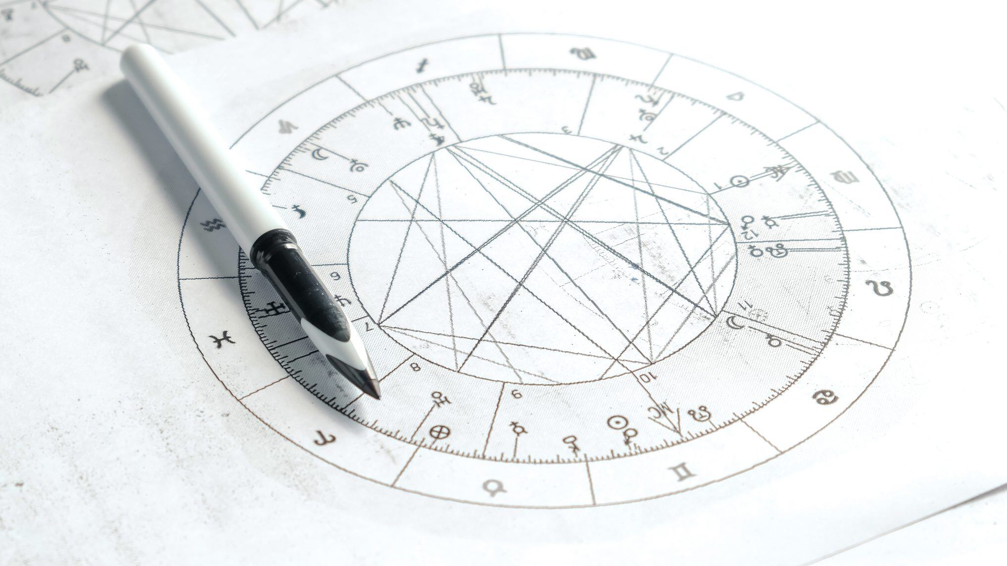 Astrology. Astrologer calculates natal chart and makes a forecast of fate.Tarot cards, Fortune telling on tarot cards magic crystal, occultism, Esoteric background. Fortune telling,tarot predictions.