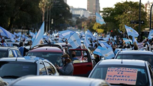 Citizens take part in a protest -called by social networks under the slogan "#13STodosALasCalles to defend the Republic"- against the extension of the mandatory quarantine, which has already lasted 180 days, and the governments judicial reform bill in Buenos Aires on September 13, 2020. (Photo by ALEJANDRO PAGNI / AFP) (Photo by ALEJANDRO PAGNI/AFP via Getty Images)