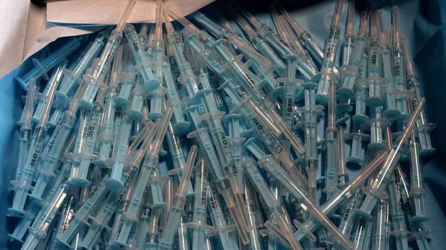 Syringes are pictured at a drive-through coronavirus vaccination centre at the Nuevo Colombino stadium in Huelva on March 22, 2021. - Spain raised the maximum age limit for people to receive the AstraZeneca vaccine, which has faced setbacks in Europe due to safety concerns, from 55 to 65. (Photo by CRISTINA QUICLER / AFP) (Photo by CRISTINA QUICLER/AFP via Getty Images)
