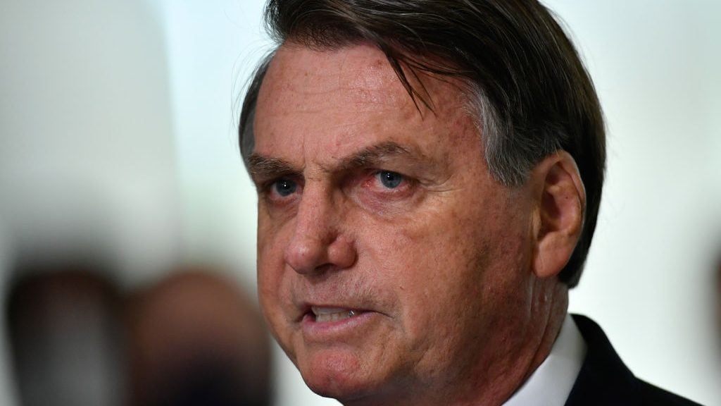 BRASILIA, BRAZIL - MARCH 31: President of Brazil Jair Bolsonaro speaks during pronouncement on the new emergency aid amidst the coronavirus pandemic (COVID-19) at the Planalto Palace, on March 31,2021 in Brasilia, Brazil. Brazil has over 12,658,000 confirmed positive cases of Coronavirus and has over 317,646 deaths. (Photo by Mateus Bononi/Getty Images)