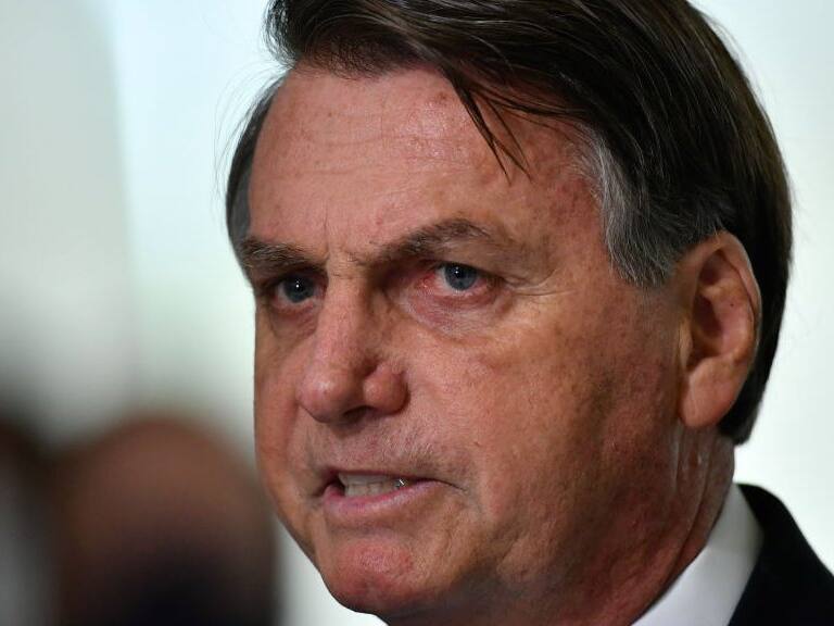 BRASILIA, BRAZIL - MARCH 31: President of Brazil Jair Bolsonaro speaks during pronouncement on the new emergency aid amidst the coronavirus pandemic (COVID-19) at the Planalto Palace, on March 31,2021 in Brasilia, Brazil. Brazil has over 12,658,000 confirmed positive cases of Coronavirus and has over 317,646 deaths. (Photo by Mateus Bononi/Getty Images)