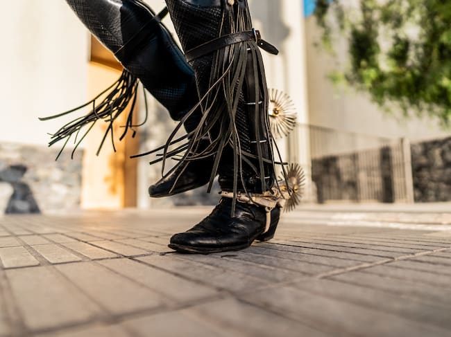Close-up of the feet of a huaso dancing at a folkloric cueca event