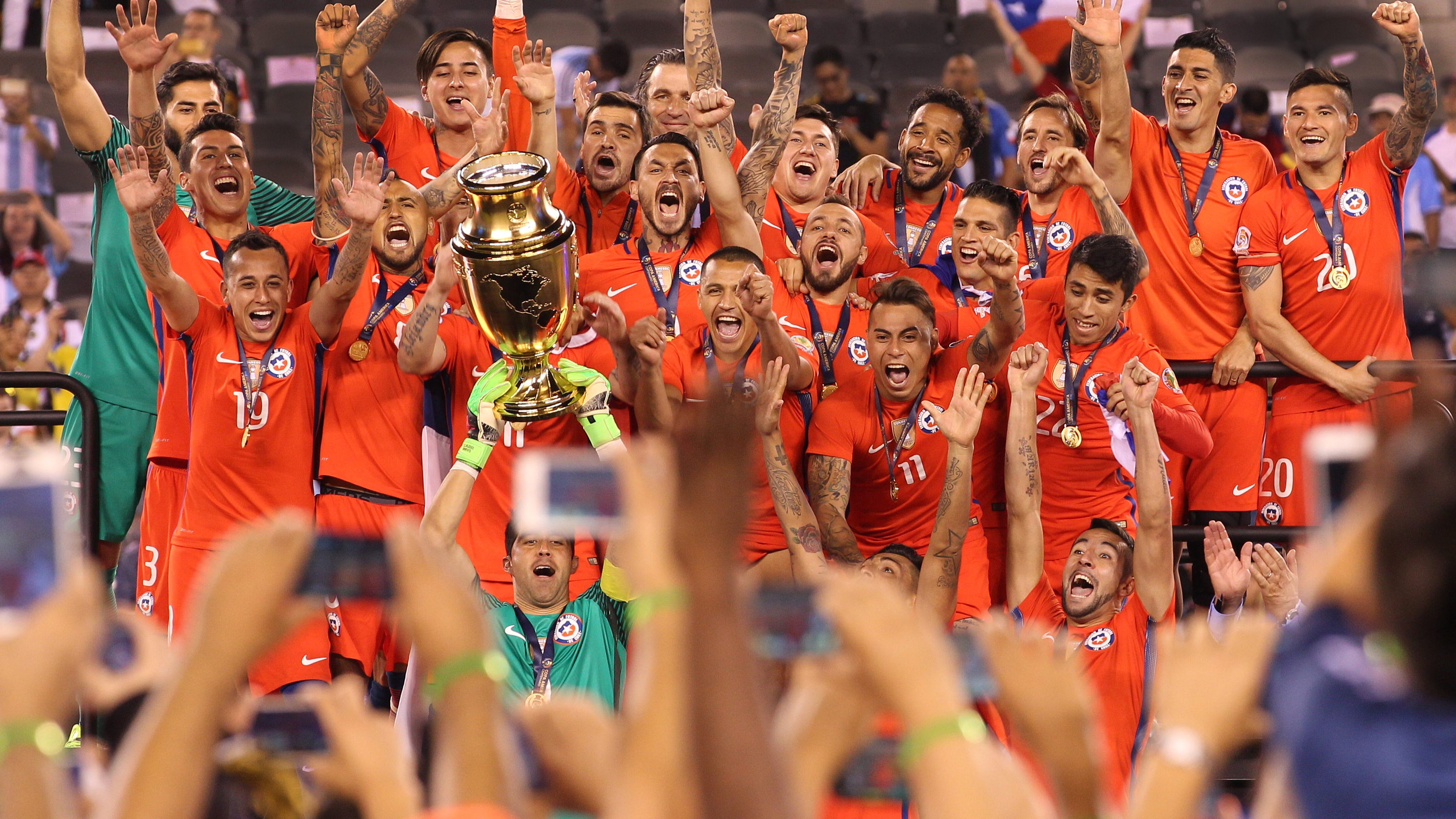 EAST RUTHERFORD, NEW JERSEY - JUNE 26: Chile players celebrate their victory at the trophy presentation after their penalty shoot out win during the Argentina Vs Chile Final match of the Copa America Centenario USA 2016 Tournament at MetLife Stadium on June 26, 2016 in East Rutherford, New Jersey. (Photo by Tim Clayton/Corbis via Getty Images)