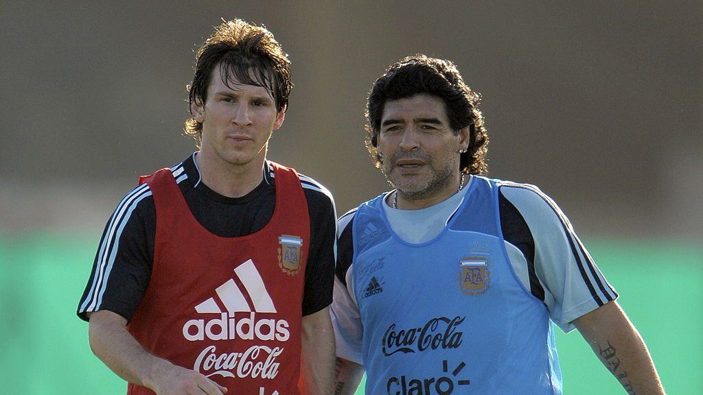 Argentina's football team coach Diego Maradona speaks with forward Lionel Messi (L) during a training session in Ezeiza, Buenos Aires on March 24, 2009. Argentina will meet Venezuela next March 28 for their FIFA World Cup South Africa 2010 qualifier at the Monumental stadium in Buenos Aires. AFP PHOTO/Juan Mabromata (Photo credit should read JUAN MABROMATA/AFP via Getty Images)