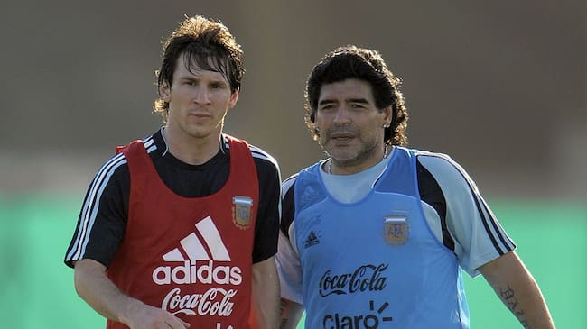 Argentina's football team coach Diego Maradona speaks with forward Lionel Messi (L) during a training session in Ezeiza, Buenos Aires on March 24, 2009. Argentina will meet Venezuela next March 28 for their FIFA World Cup South Africa 2010 qualifier at the Monumental stadium in Buenos Aires. AFP PHOTO/Juan Mabromata (Photo credit should read JUAN MABROMATA/AFP via Getty Images)