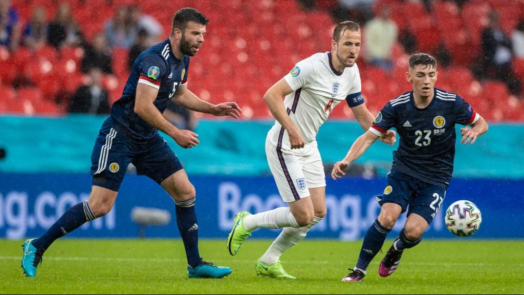 ENGLAND, SCOTLAND - JUNE 18: Scotland's Grant Hanley (left) and Billy Gilmour hold off England's Harry Kane during a Euro 2020 match between England and Scotland at Wembley Stadium, on June 18, 2021, in London, England. (Photo by Craig Williamson/SNS Group via Getty Images)
