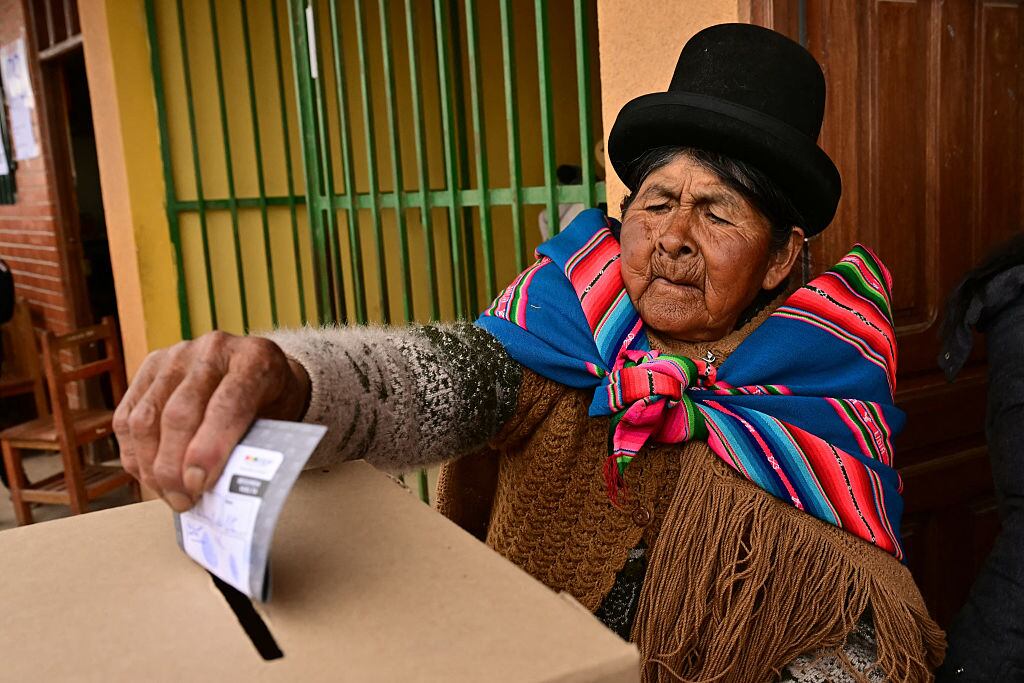 An Aymara woman casts her vote during the presidential runoff election, in Laja, some 30km west of La Paz, on October 19, 2025. Bolivians head to the polls to choose between right-wing candidates Jorge 'Tuto' Quiroga and Senator Rodrigo Paz, both promising change as the country of some 12 million people sees the end of two decades of socialist rule. (Photo by MARTIN BERNETTI / AFP) (Photo by MARTIN BERNETTI/AFP via Getty Images)          