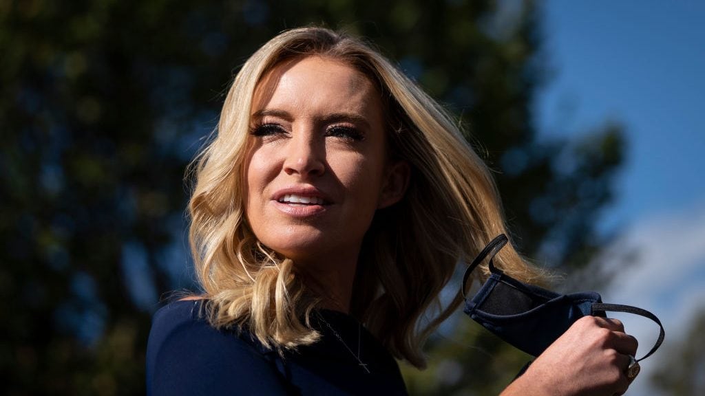 WASHINGTON, DC - OCTOBER 02: White House Press Secretary Kayleigh McEnany takes off her face covering before speaking with reporters outside the West Wing of the White House on October 2, 2020 in Washington, DC. President Donald Trump and First Lady Melania Trump have both tested positive for coronavirus. (Photo by Drew Angerer/Getty Images)