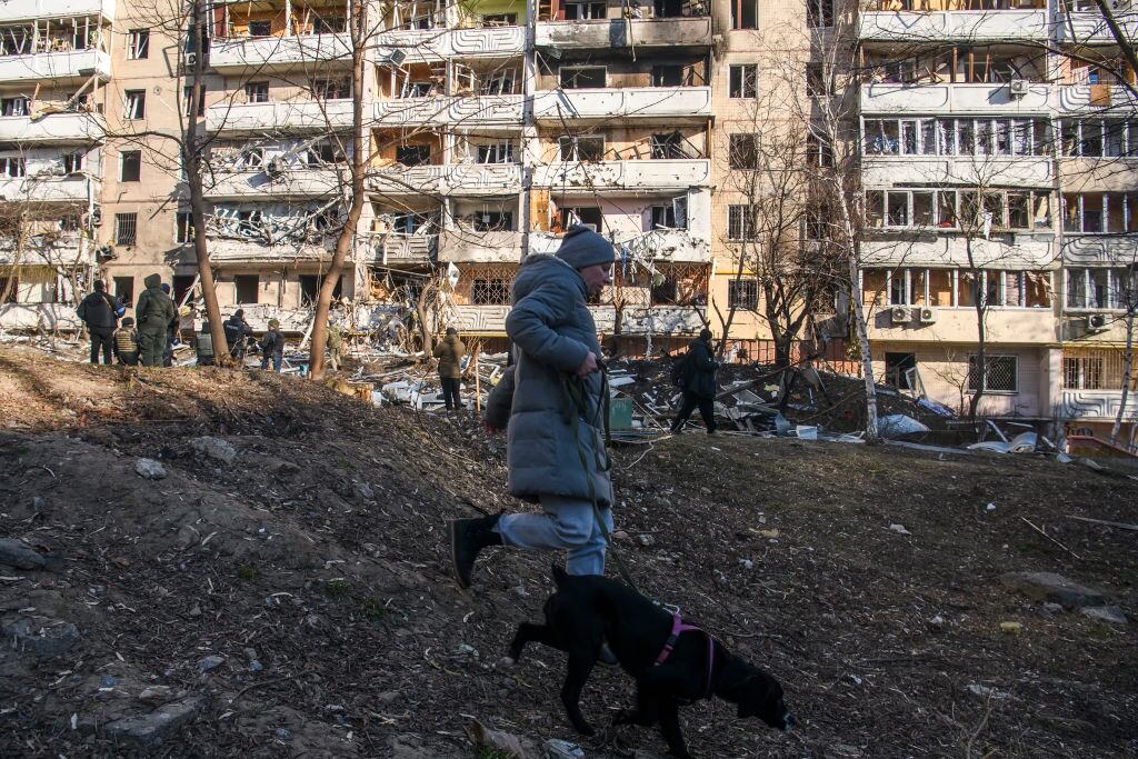 People near Residential apartment building in residential district of Kyiv after it was hit by shelling early morning as Russia's invasion of Ukraine continues, in Kyiv, Ukraine, March 15, 2022 (Photo by Maxym Marusenko/NurPhoto via Getty Images)