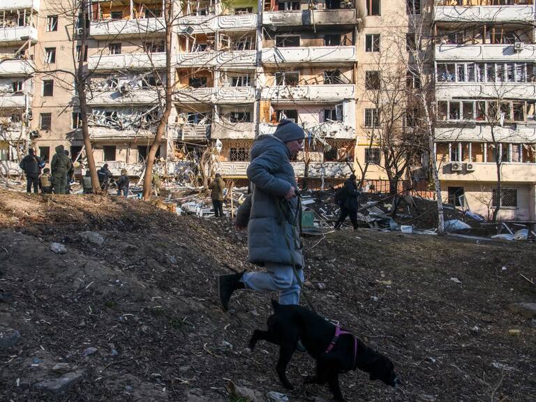 People near Residential apartment building in residential district of Kyiv after it was hit by shelling early morning as Russia's invasion of Ukraine continues, in Kyiv, Ukraine, March 15, 2022 (Photo by Maxym Marusenko/NurPhoto via Getty Images)