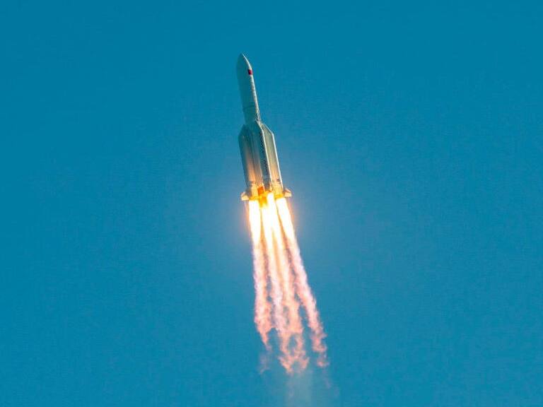 A Long March 5B rocket lifts off from the the Wenchang launch site on China's southern Hainan island on May 5, 2020. - Chinese state media reported the "successful" launch of a new rocket on May 5, a major test of its ambitions to operate a permanent space station and send astronauts to the Moon. (Photo by STR / AFP) / China OUT (Photo by STR/AFP via Getty Images)