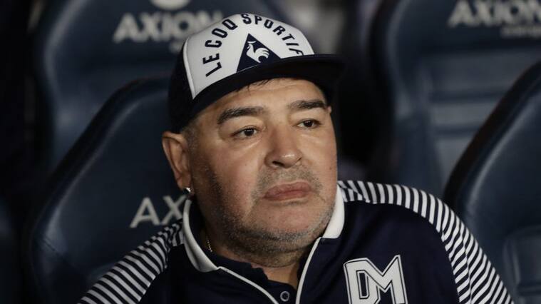 Argentine former football star Diego Maradona gestures during an homage before the start of the Argentina First Division 2020 Superliga Tournament football match Boca Juniors vs Gimnasia La Plata, at La Bombonera stadium, in Buenos Aires, on March 7, 2020. (Photo by ALEJANDRO PAGNI / AFP) (Photo by ALEJANDRO PAGNI/AFP via Getty Images)