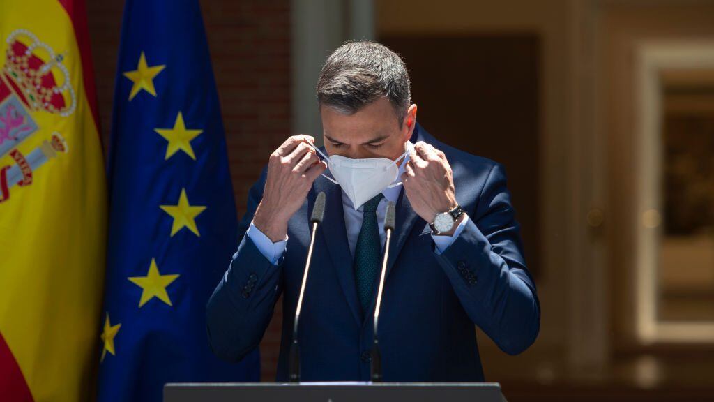 MADRID, SPAIN - MAY 18: The President of the Government, Pedro Sanchez, puts on his mask to speak at a press conference after the conclusion of the Council of Ministers, on 18 May, 2021 in Madrid, Spain. The Council of Ministers has assessed today, among other issues, the events in Ceuta and Melilla, where there has been the irregular arrival of numerous immigrants in recent hours. (Photo By EUROPA PRESS/A.Ortega.POOL via Getty Images)