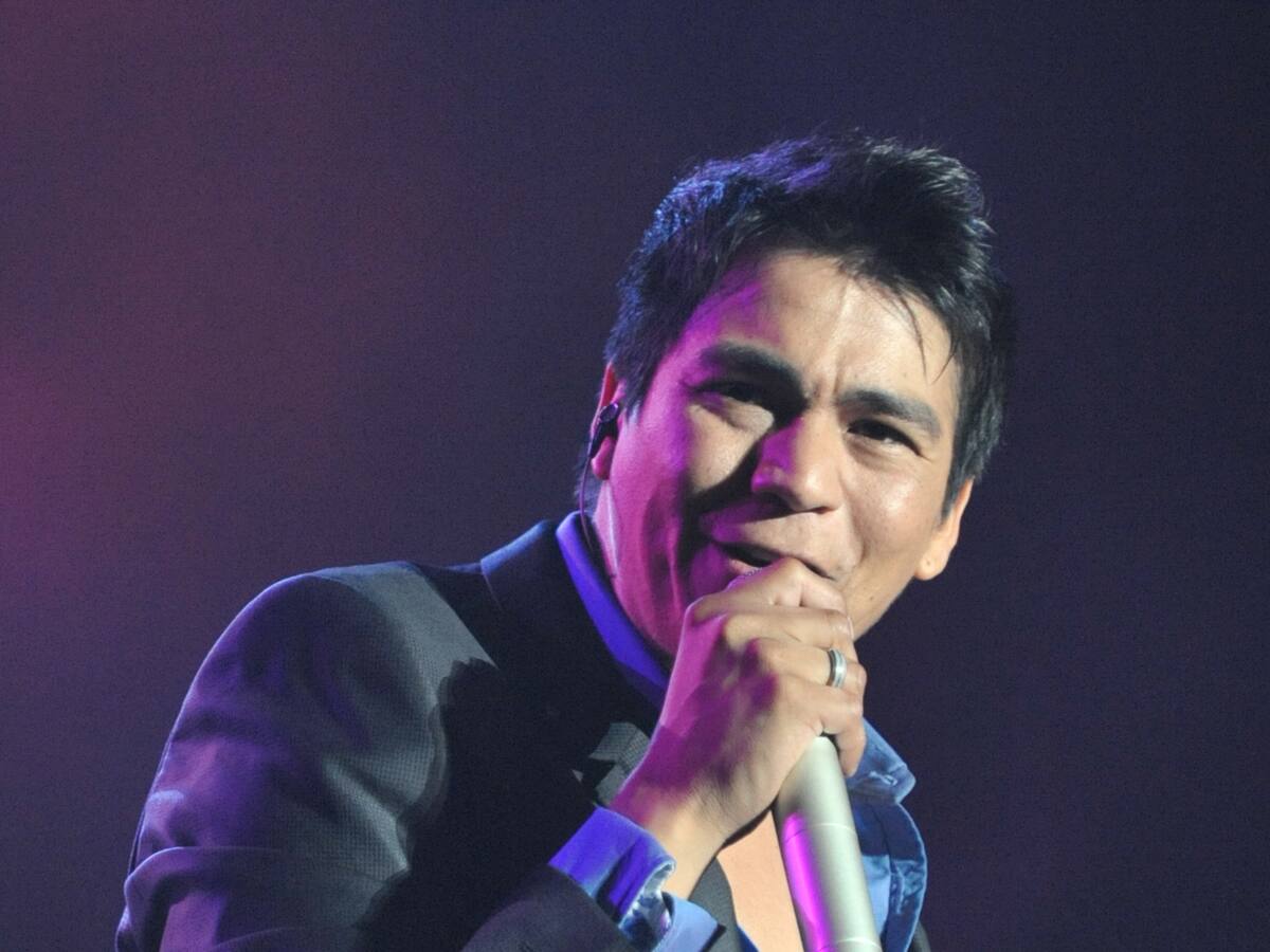 En medio de su polémica: Américo se subirá al escenario con importante artista al Lollapalooza 2026