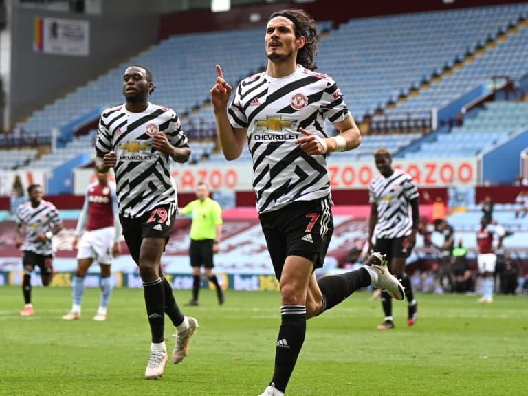 BIRMINGHAM, ENGLAND - MAY 09: Edinson Cavani of Manchester United celebrates after scoring their side&#039;s third goal during the Premier League match between Aston Villa and Manchester United at Villa Park on May 09, 2021 in Birmingham, England. Sporting stadiums around the UK remain under strict restrictions due to the Coronavirus Pandemic as Government social distancing laws prohibit fans inside venues resulting in games being played behind closed doors. (Photo by Shaun Botterill/Getty Images)