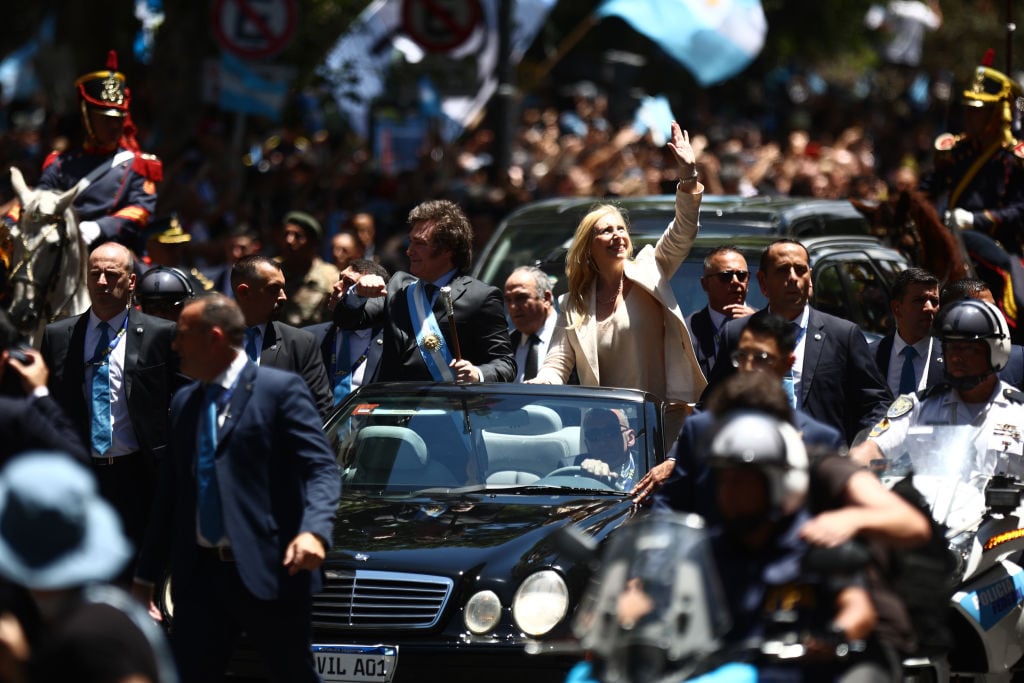 BUENOS AIRES, ARGENTINA - DECEMBER 10: President of Argentina Javier Milei and his sister Karina Milei greet supporters as they leave the National Congress after his Inauguration Ceremony on December 10, 2023 in Buenos Aires, Argentina. (Photo by Tomas Cuesta/Getty Images)