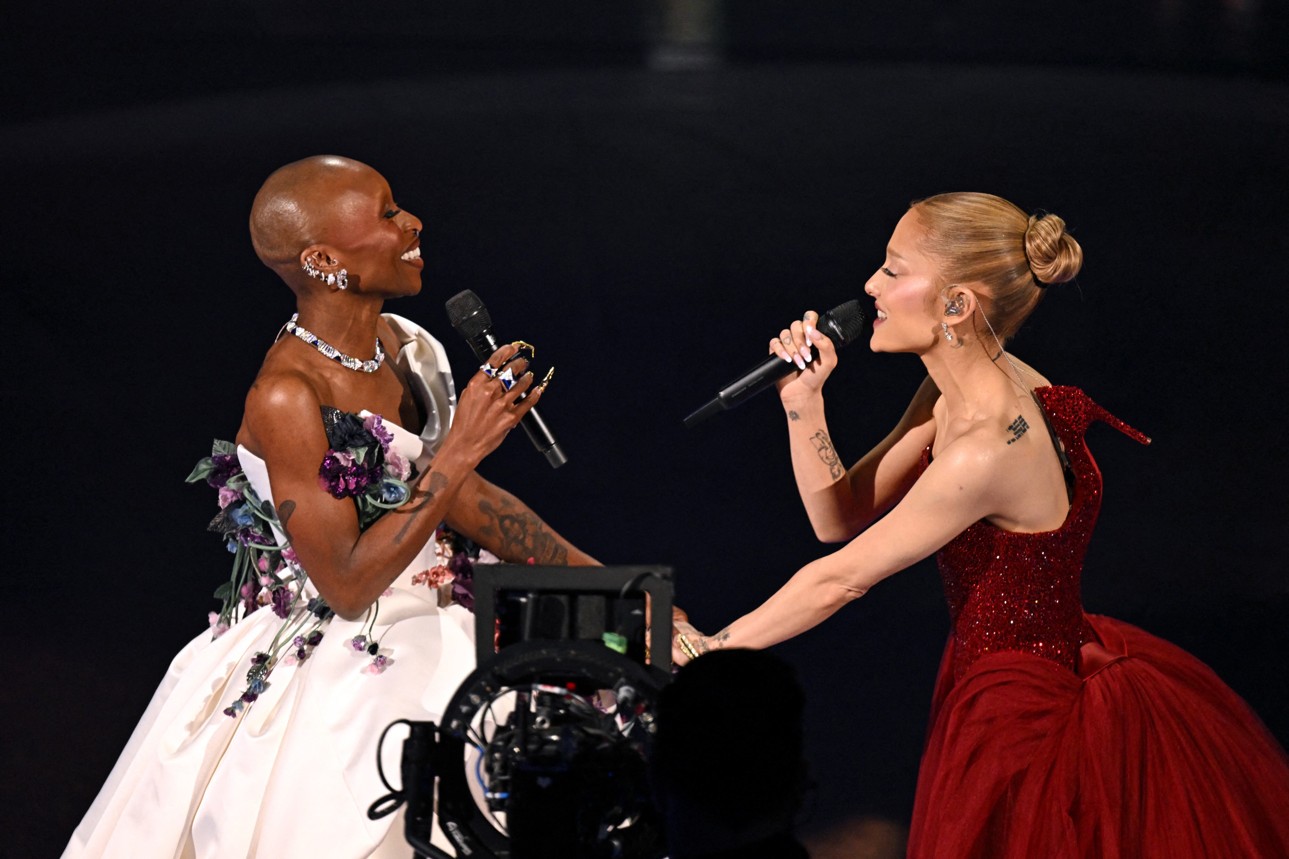 British singer and actress Cynthia Erivo (L) and US singer and actress Ariana Grande perform onstage during the 97th Annual Academy Awards at the Dolby Theatre in Hollywood, California on March 2, 2025. (Photo by Patrick T. Fallon / AFP) (Photo by PATRICK T. FALLON/AFP via Getty Images)
