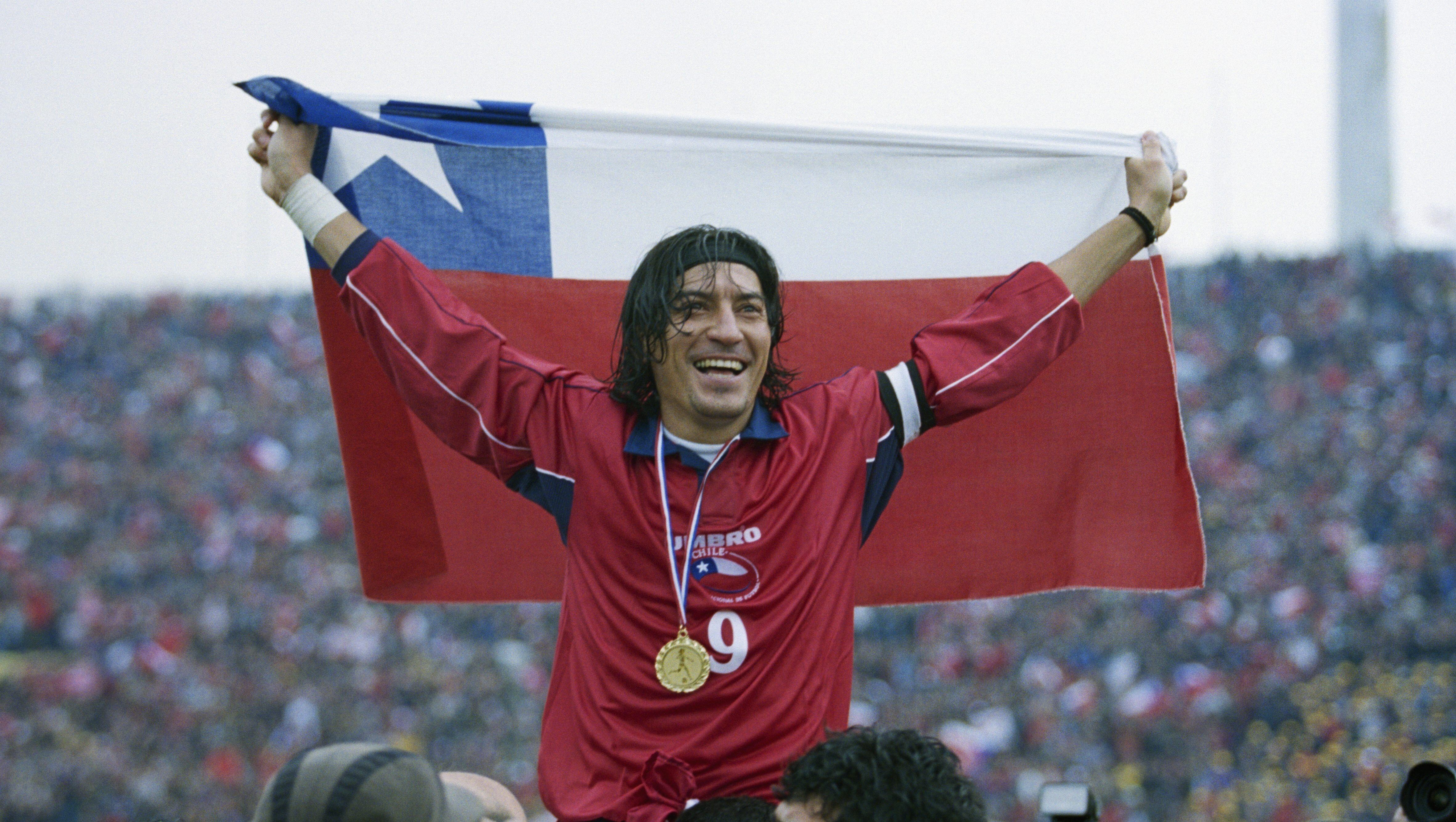 Ivan Zamorano (Chile) is held aloft after a friendly match against France. Chile won 2-1. (Photo by Stephane Reix/Corbis/VCG via Getty Images)