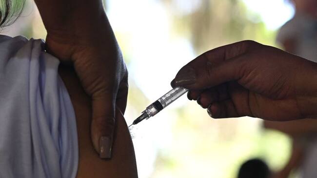 A resident receives a dose of AstraZeneca/Oxford vaccine against Covid-19 during the first day of a mass vaccination campaign within the 'Paqueta Vaccinated' project, at Paqueta island in Rio de Janeiro, Brazil on June 20, 2021. - Rio de Janeiro Municipal Health Department, with the support of the Oswaldo Cruz Foundation (Fiocruz), is carrying out the project in the island to evaluate the effects of immunization on a large scale. (Photo by Andre Borges / AFP) (Photo by ANDRE BORGES/AFP via Getty Images)