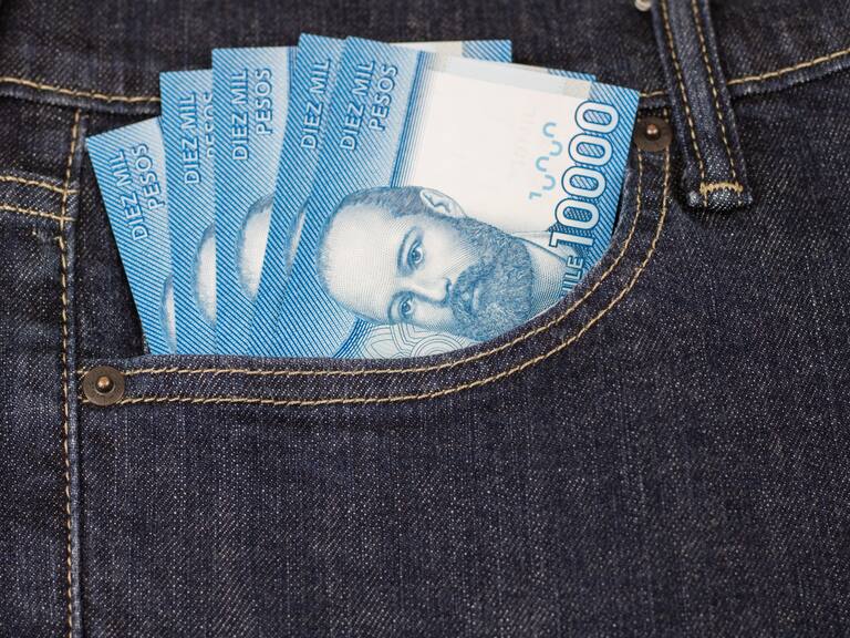High resolution image. Chilean pesos bills in jeans pocket. Ten thousands.