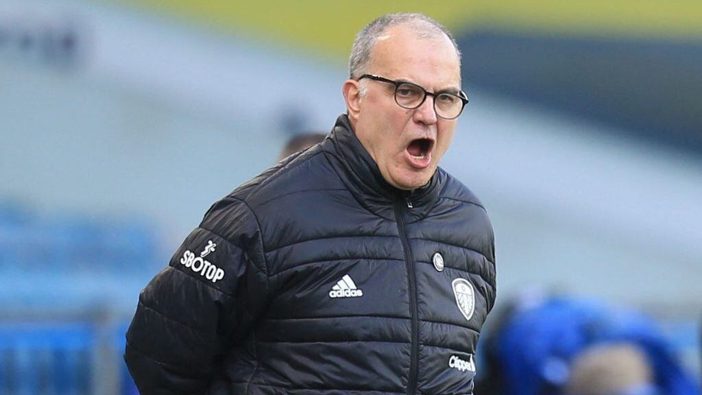 Leeds United's Argentinian head coach Marcelo Bielsa reacts during the English Premier League football match between Leeds United and Sheffield United at Elland Road in Leeds, northern England on April 3, 2021. - RESTRICTED TO EDITORIAL USE. No use with unauthorized audio, video, data, fixture lists, club/league logos or 'live' services. Online in-match use limited to 120 images. An additional 40 images may be used in extra time. No video emulation. Social media in-match use limited to 120 images. An additional 40 images may be used in extra time. No use in betting publications, games or single club/league/player publications. (Photo by Lindsey Parnaby / POOL / AFP) / RESTRICTED TO EDITORIAL USE. No use with unauthorized audio, video, data, fixture lists, club/league logos or 'live' services. Online in-match use limited to 120 images. An additional 40 images may be used in extra time. No video emulation. Social media in-match use limited to 120 images. An additional 40 images may be used in extra time. No use in betting publications, games or single club/league/player publications. / RESTRICTED TO EDITORIAL USE. No use with unauthorized audio, video, data, fixture lists, club/league logos or 'live' services. Online in-match use limited to 120 images. An additional 40 images may be used in extra time. No video emulation. Social media in-match use limited to 120 images. An additional 40 images may be used in extra time. No use in betting publications, games or single club/league/player publications. (Photo by LINDSEY PARNABY/POOL/AFP via Getty Images)