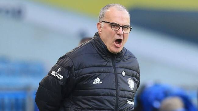 Leeds United's Argentinian head coach Marcelo Bielsa reacts during the English Premier League football match between Leeds United and Sheffield United at Elland Road in Leeds, northern England on April 3, 2021. - RESTRICTED TO EDITORIAL USE. No use with unauthorized audio, video, data, fixture lists, club/league logos or 'live' services. Online in-match use limited to 120 images. An additional 40 images may be used in extra time. No video emulation. Social media in-match use limited to 120 images. An additional 40 images may be used in extra time. No use in betting publications, games or single club/league/player publications. (Photo by Lindsey Parnaby / POOL / AFP) / RESTRICTED TO EDITORIAL USE. No use with unauthorized audio, video, data, fixture lists, club/league logos or 'live' services. Online in-match use limited to 120 images. An additional 40 images may be used in extra time. No video emulation. Social media in-match use limited to 120 images. An additional 40 images may be used in extra time. No use in betting publications, games or single club/league/player publications. / RESTRICTED TO EDITORIAL USE. No use with unauthorized audio, video, data, fixture lists, club/league logos or 'live' services. Online in-match use limited to 120 images. An additional 40 images may be used in extra time. No video emulation. Social media in-match use limited to 120 images. An additional 40 images may be used in extra time. No use in betting publications, games or single club/league/player publications. (Photo by LINDSEY PARNABY/POOL/AFP via Getty Images)