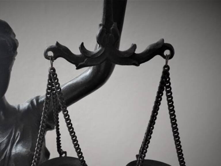 Small figure representing the law