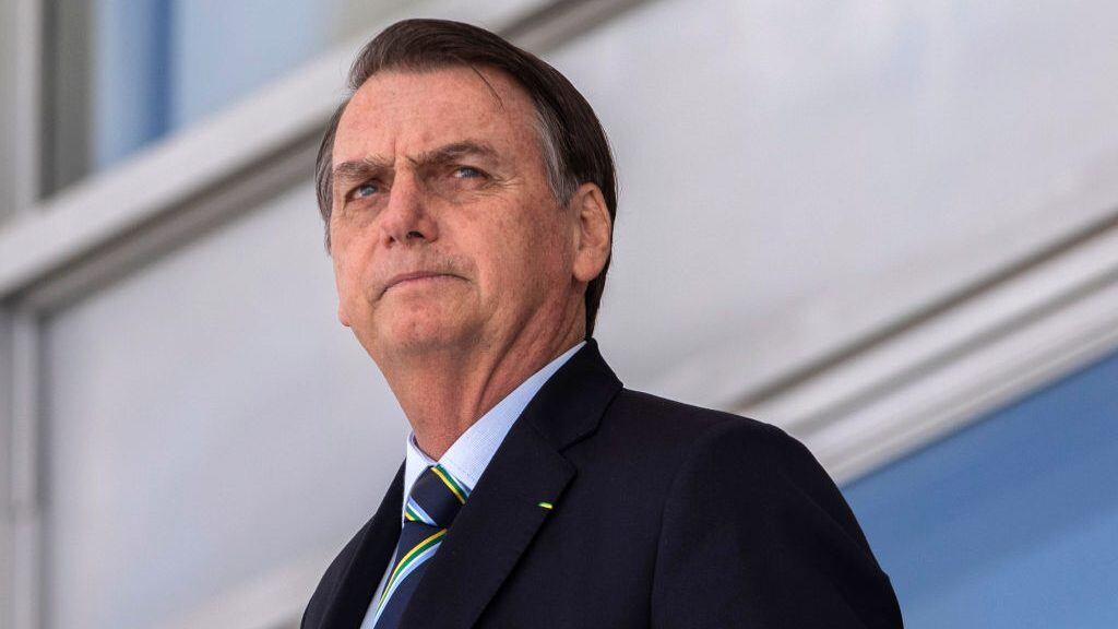 Brazil's President Jair Bolsonaro, welcomes Paraguay's President Mario Abdo Benitez (out of frame) at Planalto palace in Brasilia on March 12, 2019. (Photo by Sergio LIMA / AFP)        (Photo credit should read SERGIO LIMA/AFP via Getty Images)