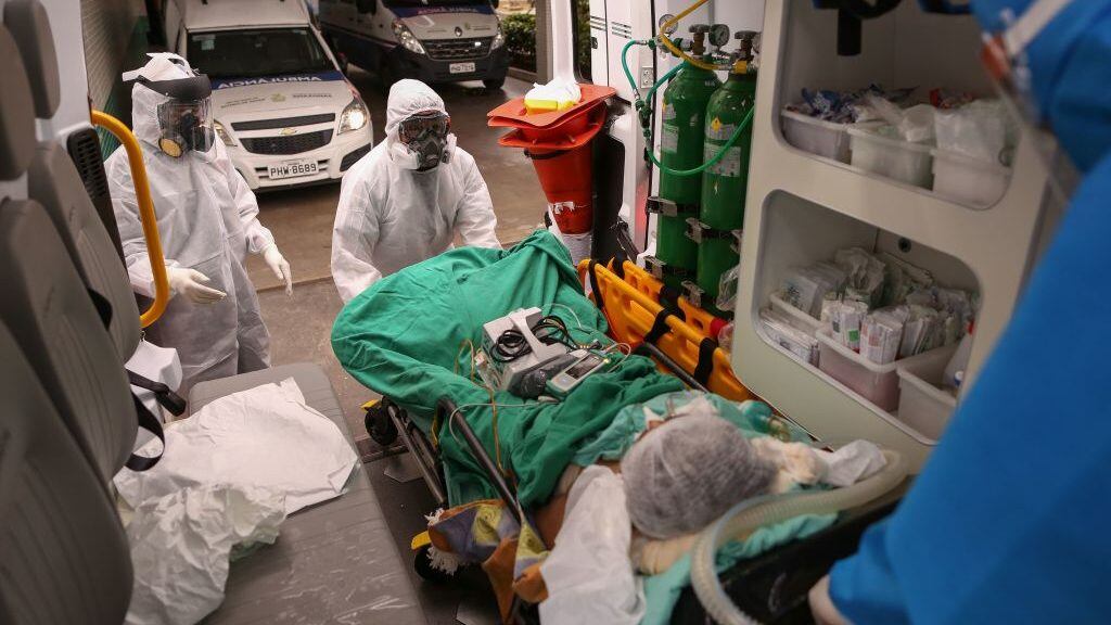 Members of the emergency medical service SAMU arrive with a patient suspected of being infected with the novel coronavirus COVID-19, at the hospital in Manaus, Brazil, on May 5, 2020. - (Photo by MICHAEL DANTAS / AFP) (Photo by MICHAEL DANTAS/AFP via Getty Images)