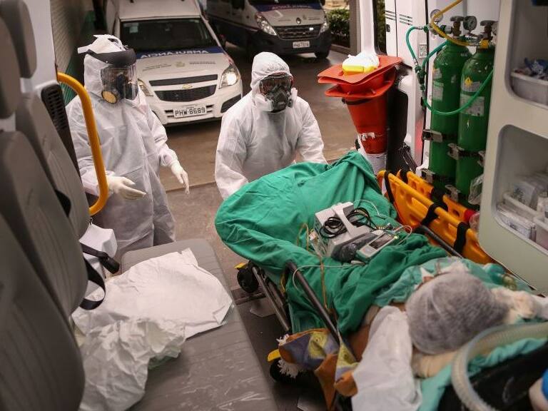 Members of the emergency medical service SAMU arrive with a patient suspected of being infected with the novel coronavirus COVID-19, at the hospital in Manaus, Brazil, on May 5, 2020. - (Photo by MICHAEL DANTAS / AFP) (Photo by MICHAEL DANTAS/AFP via Getty Images)