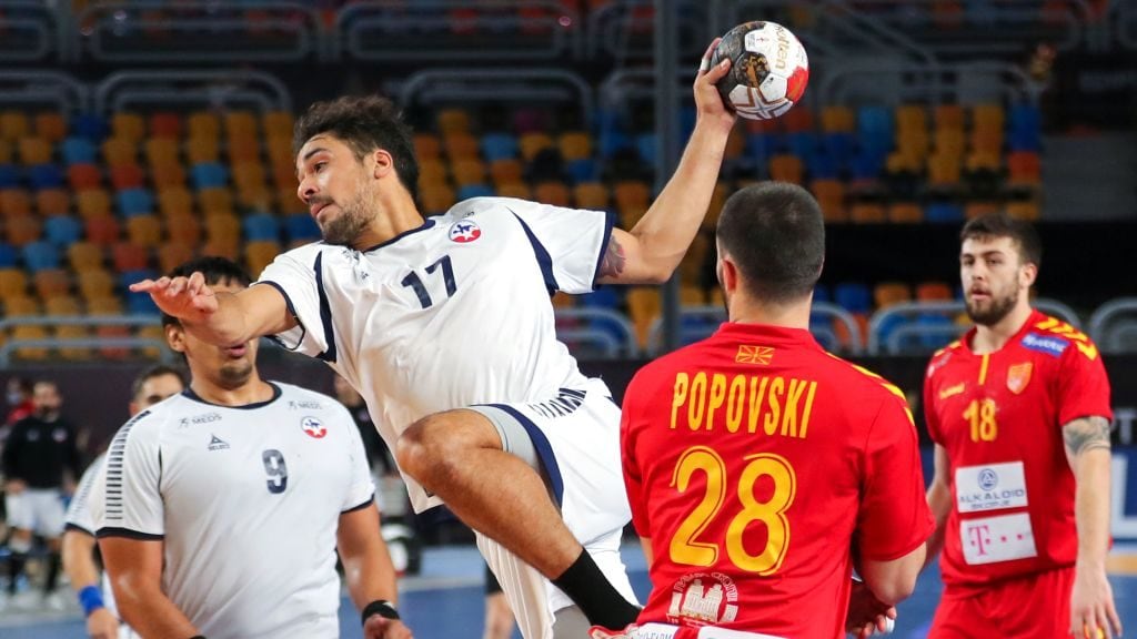 Chile's right back Rodrigo Salinas (C) attempts a shot during the 2021 World Men's Handball Championship match between Group G teams North Macedonia and Chile at the Cairo Stadium Sports Hall in the Egyptian capital on January 18, 2021. (Photo by MOHAMED ABD EL GHANY / POOL / AFP) (Photo by MOHAMED ABD EL GHANY/POOL/AFP via Getty Images)
