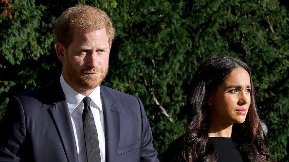 WINDSOR, ENGLAND - SEPTEMBER 10: Prince Harry, Duke of Sussex, and Meghan, Duchess of Sussex on the long Walk at Windsor Castle arrive to view flowers and tributes to HM Queen Elizabeth on September 10, 2022 in Windsor, England. Crowds have gathered and tributes left at the gates of Windsor Castle to Queen Elizabeth II, who died at Balmoral Castle on 8 September, 2022. (Photo by Chris Jackson/Getty Images)