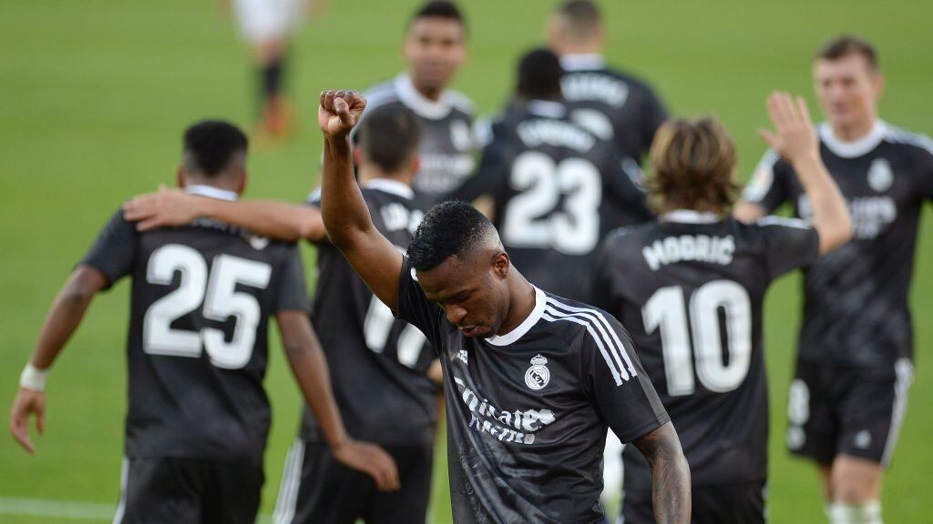 Real Madrid's Brazilian forward Vinicius Junior celebrates after scoring a goal during the Spanish League football match between Sevilla and Real Madrid at the Sanchez Pizjuan stadium in Seville on December 5, 2020. (Photo by CRISTINA QUICLER / AFP) (Photo by CRISTINA QUICLER/AFP via Getty Images)