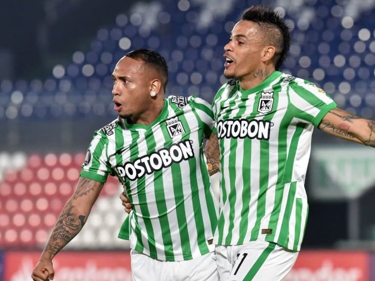 Colombia&#039;s Atletico Nacional Jarlan Barrera (L) celebrates with Uruguayan teammate Jonatan Alvez after scoring a goal deflected into the net by Paraguay&#039;s Guarani Alexis Villalba during their Copa Libertadores football tournament second round match at Defensores del Chaco Stadium in Asuncion on March 11, 2021. (Photo by Norberto DUARTE / AFP) (Photo by NORBERTO DUARTE/AFP via Getty Images)