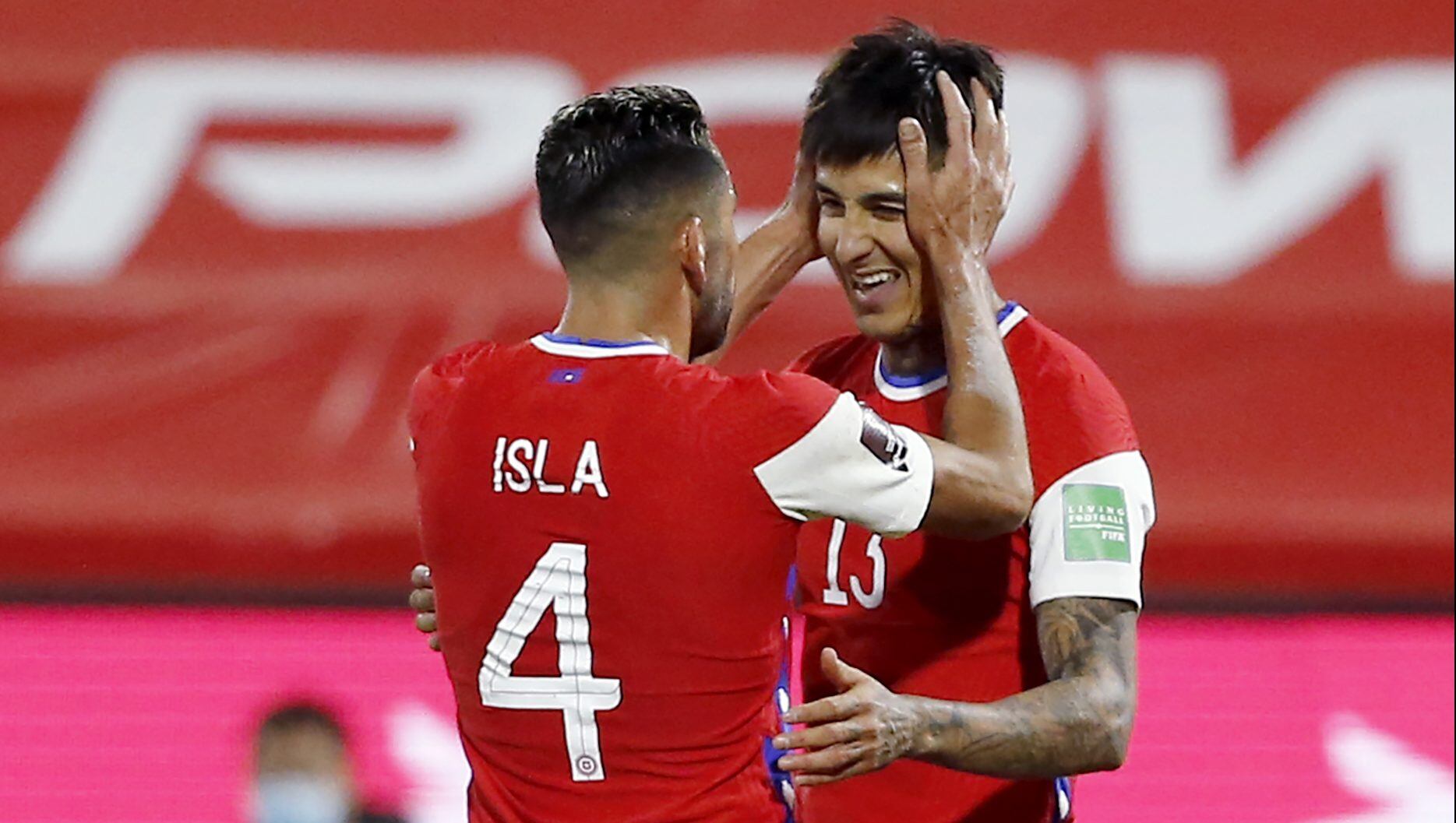 SANTIAGO, CHILE - JUNE 08: Erick Pulgar of Chile celebrates with teammate Mauricio Isla after scoring the first goal of his team during a match between Chile and Bolivia as part of South American Qualifiers for Qatar 2022 at Estadio San Carlos de Apoquindo on June 08, 2021 in Santiago, Chile. (Photo by Marcelo Hernandez/Getty Images)