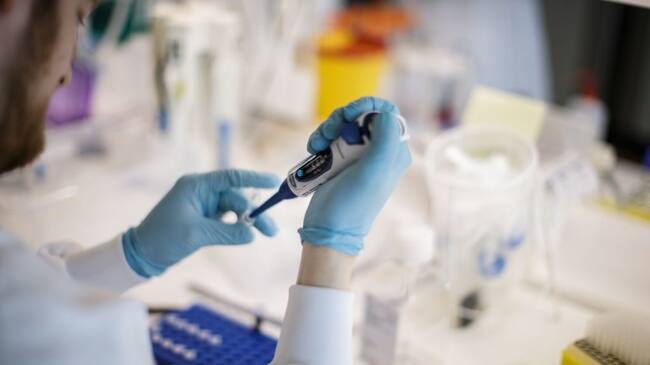 TOPSHOT - A researcher works on a vaccine against the new coronavirus COVID-19 at the Copenhagen's University research lab in Copenhagen, Denmark, on March 23, 2020. - At Copenhagen university, a team of about 10 researchers is working around the clock to develop a vaccine against Covid-19 that could apply for clinical trial before within nine months. The vaccine will be based on two components : the protein which is on the surface of the coronavirus, called the spike protein that researchers express in the lab and then attach it on the surface of a virus-like particle. (Photo by Thibault Savary / AFP) (Photo by THIBAULT SAVARY/AFP via Getty Images)