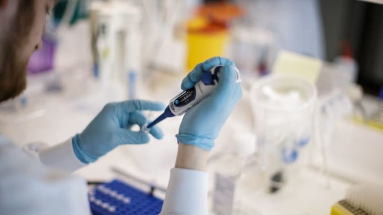 TOPSHOT - A researcher works on a vaccine against the new coronavirus COVID-19 at the Copenhagen's University research lab in Copenhagen, Denmark, on March 23, 2020. - At Copenhagen university, a team of about 10 researchers is working around the clock to develop a vaccine against Covid-19 that could apply for clinical trial before within nine months. The vaccine will be based on two components : the protein which is on the surface of the coronavirus, called the spike protein that researchers express in the lab and then attach it on the surface of a virus-like particle. (Photo by Thibault Savary / AFP) (Photo by THIBAULT SAVARY/AFP via Getty Images)
