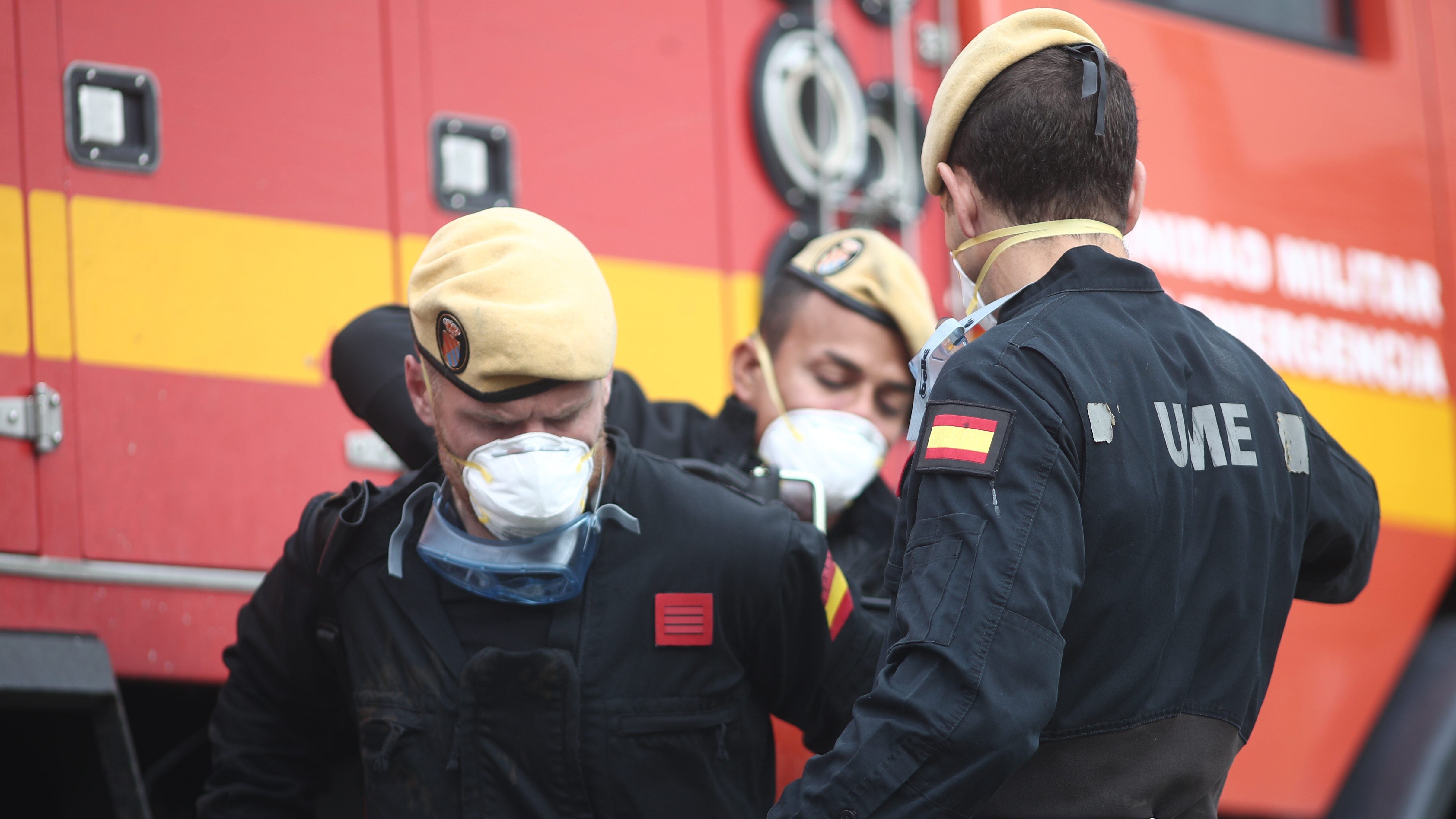 MADRID, SPAIN - APRIL 01: Three soldiers of the Military Emergency Unit are seen carrying material to disinfect the nursing and day centre ORPEA Sanchinarro for the second time to stop coronavirus infection on April 01, 2020 in Madrid, Spain. (Photo by Eduardo Parra/Europa Press via Getty Images)