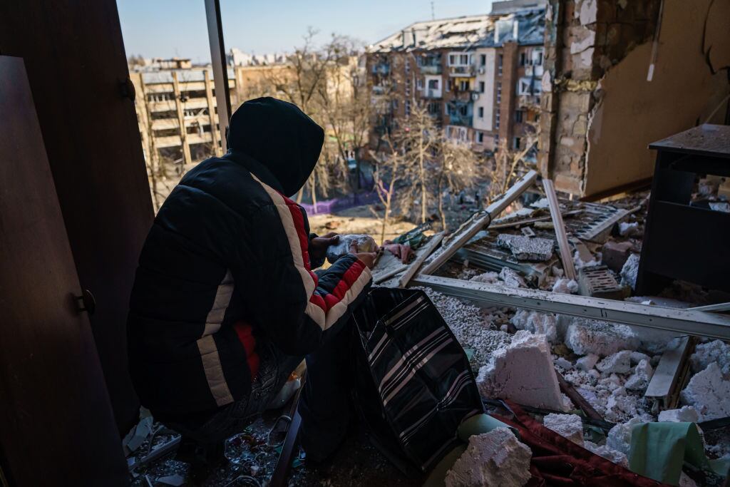 KYIV, UKRAINE -- MARCH 18, 2022: Nickolai, first name only, examines his room that has been damaged by what authorities called a Russian bombardment landing in a residential neighborhood in Kyiv, Ukraine, Friday, March 18, 2022. (MARCUS YAM / LOS ANGELES TIMES)