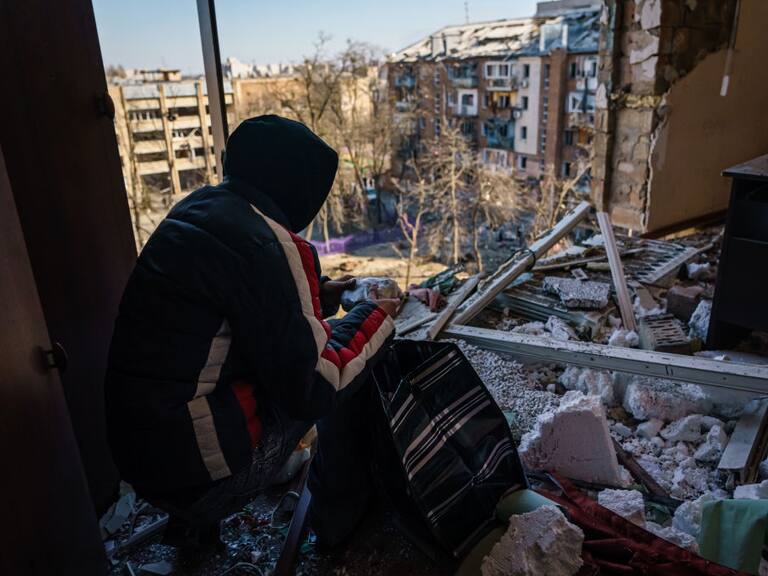 KYIV, UKRAINE -- MARCH 18, 2022: Nickolai, first name only, examines his room that has been damaged by what authorities called a Russian bombardment landing in a residential neighborhood in Kyiv, Ukraine, Friday, March 18, 2022. (MARCUS YAM / LOS ANGELES TIMES)