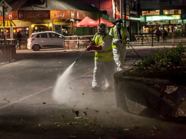 Workers of a cleaning company clean the streets of the city, in Osorno, Chile, on March 18, 2020.President Sebastian Pinera decreed a state of catastrophe throughout Chile for ninety days before the advance of Covid-19, this measure is in effect from 00:00 on Thursday, March 19. The President has the exceptional powers to restrict: the freedoms of locomotion and assembly; arrange requisitions of goods; establish limitations to the exercise of the property right; and, adopt all the extraordinary administrative measures that are necessary for the prompt restoration of normality in the affected area, in Osorno, Chile. (Photo by Fernando Lavoz/NurPhoto via Getty Images)