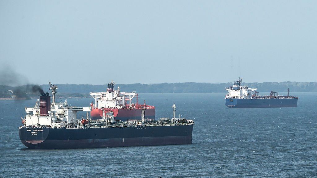 Oil tankers sail the Maracaibo Lake in Maracaibo, Venezuela on March 15 , 2019. - Production cutbacks by OPEC nations are building a supply cushion that could be called upon to mitigate a possible supply shock from an abrupt drop in crisis-hit Venezuela's output, the International Energy Agency (IEA) said Friday. (Photo by JUAN BARRETO / AFP) (Photo credit should read JUAN BARRETO/AFP via Getty Images)