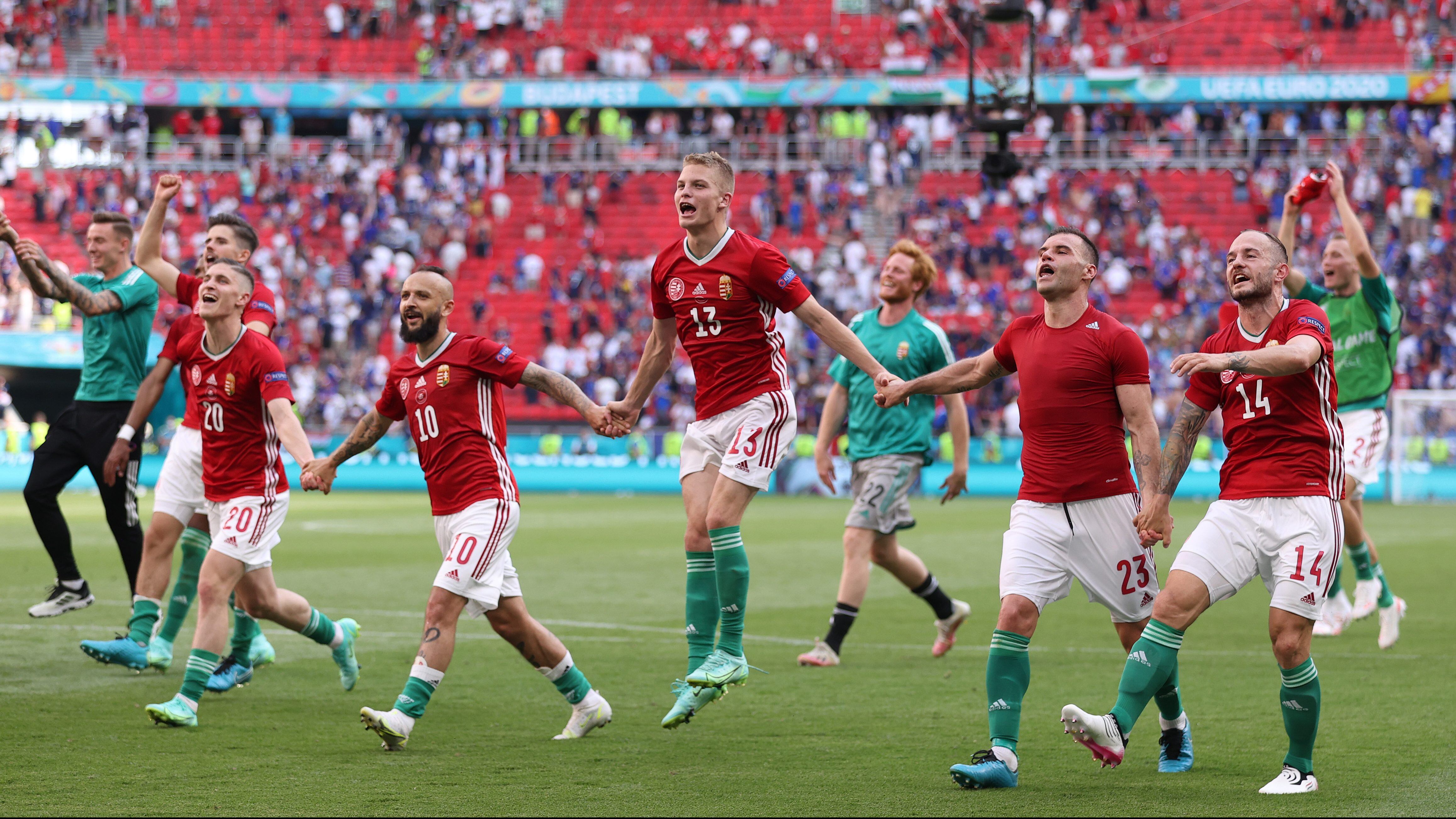 BUDAPEST, HUNGARY - JUNE 19: Roland Sallai, Tamas Cseri, Andras Schaefer, Nemanja Nikolic and Gergo Lovrencsics of Hungary celebrate in front of the fans following the UEFA Euro 2020 Championship Group F match between Hungary and France at Puskas Arena on June 19, 2021 in Budapest, Hungary. (Photo by Alex Pantling/Getty Images)