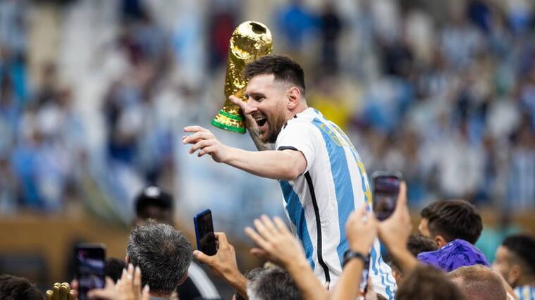 LUSAIL CITY, QATAR - DECEMBER 18: Lionel Messi of Argentina celebrates with the World Cup Trophy after the FIFA World Cup Qatar 2022 Final match between Argentina (3) and France (3) (Argentina win 4-2 on penalties) at Lusail Stadium on December 18, 2022 in Lusail City, Qatar. (Photo by Simon Bruty/Anychance/Getty Images)
