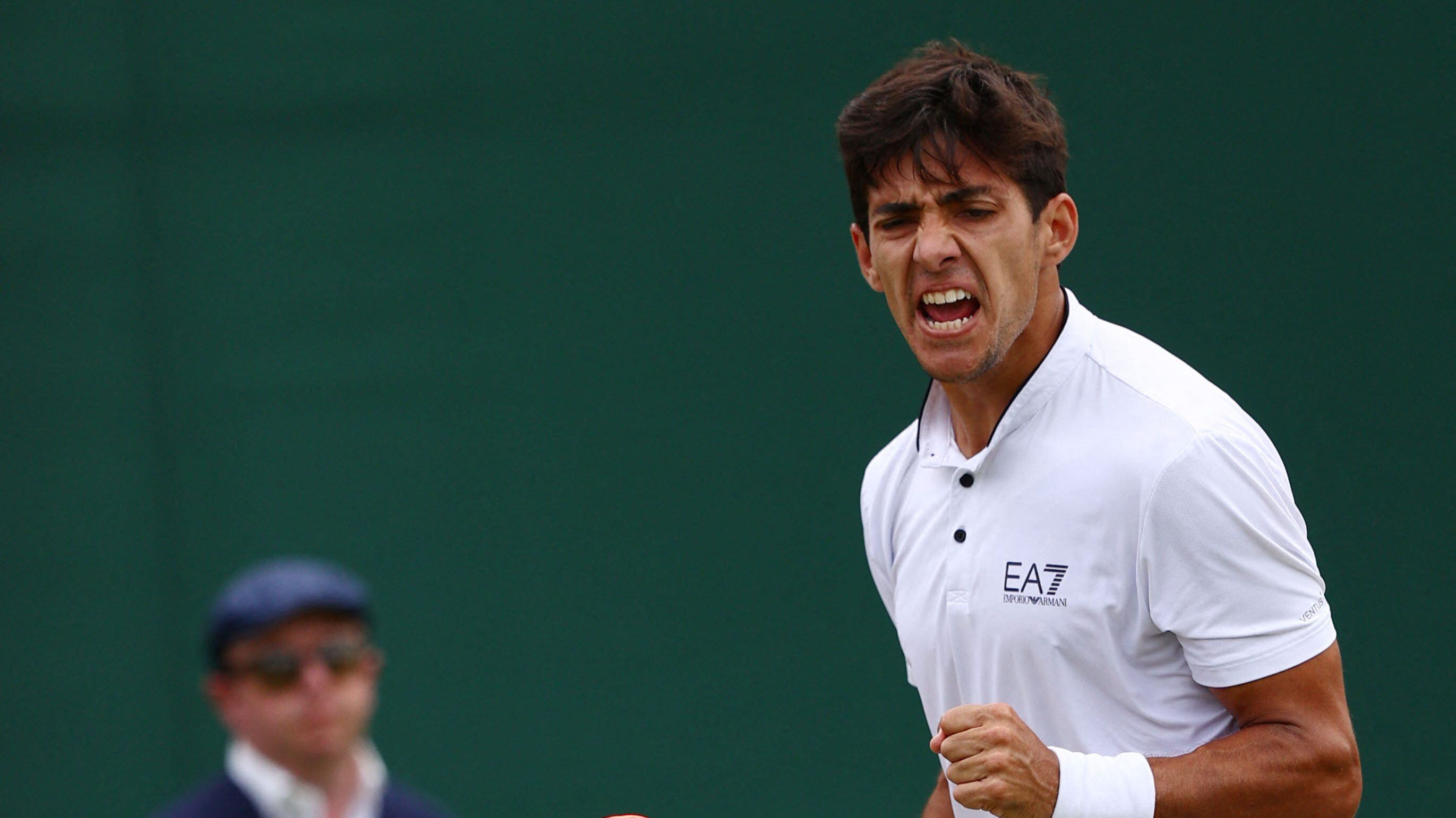 Chile's Cristian Garin reacts to winning a second set to US player Jenson Brooksby during their men's singles tennis match on the sixth day of the 2022 Wimbledon Championships at The All England Tennis Club in Wimbledon, southwest London, on July 2, 2022. - RESTRICTED TO EDITORIAL USE (Photo by Adrian DENNIS / AFP) / RESTRICTED TO EDITORIAL USE (Photo by ADRIAN DENNIS/AFP via Getty Images)