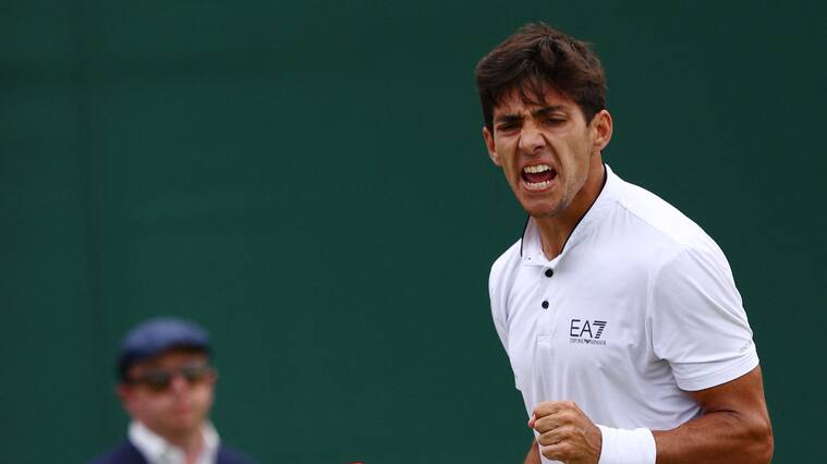 Chile's Cristian Garin reacts to winning a second set to US player Jenson Brooksby during their men's singles tennis match on the sixth day of the 2022 Wimbledon Championships at The All England Tennis Club in Wimbledon, southwest London, on July 2, 2022. - RESTRICTED TO EDITORIAL USE (Photo by Adrian DENNIS / AFP) / RESTRICTED TO EDITORIAL USE (Photo by ADRIAN DENNIS/AFP via Getty Images)
