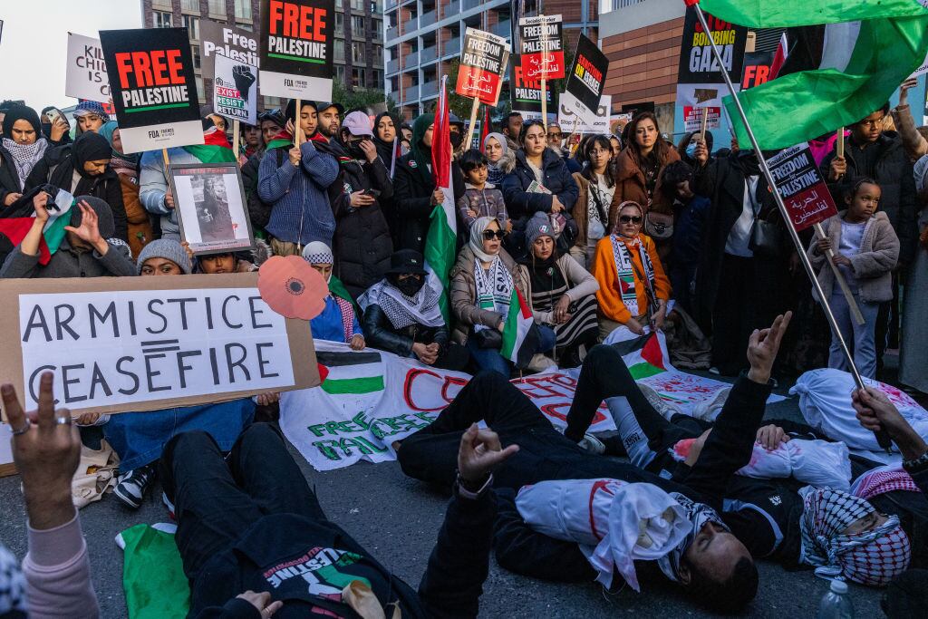 Pro-Palestinian protesters stage a die-in with mock baby corpses during an Armistice Day rally close to the US embassy to call for an immediate ceasefire in Gaza on 11th November 2023 in London, United Kingdom. The rally was organised by Palestine Solidarity Campaign (PSC), Stop the War Coalition, Friends of Al-Aqsa, Muslim Association of Britain and Palestinian Forum in Britain. Mass Palestinian solidarity rallies have been held around the world for a fifth consecutive weekend to call for an end to the Israeli bombardment of Gaza. (photo by Mark Kerrison/In Pictures via Getty Images)