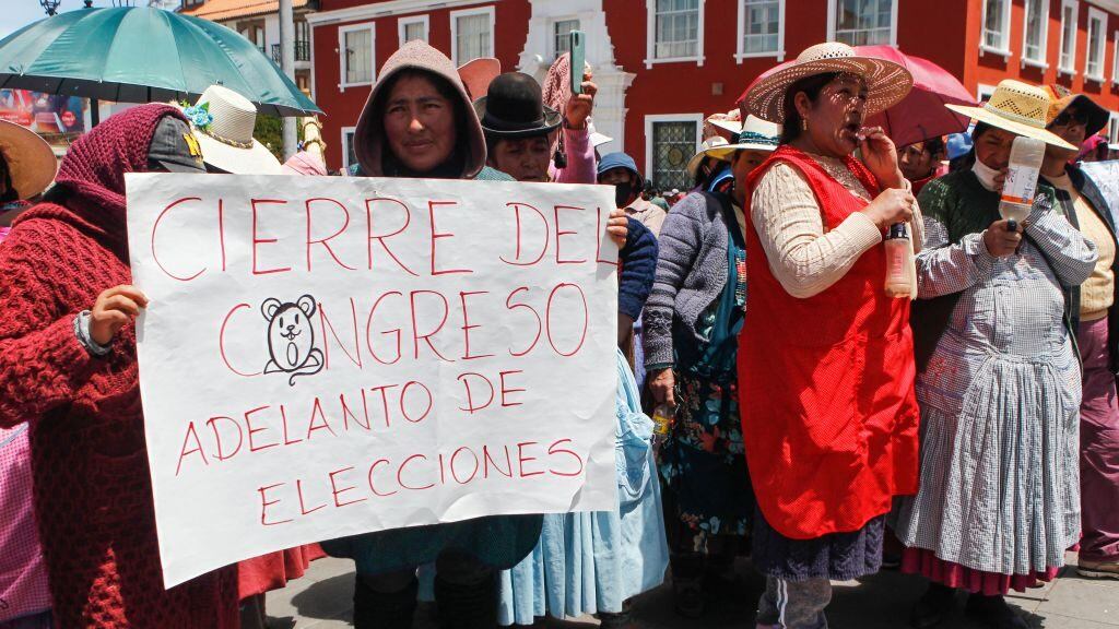 Supporters of former Peruvian President Pedro Castillo hold a demonstration demanding his release in Puno, Peru, on December 16, 2022. - Peru declared a nationwide state of emergency on December 14 over violent protests against the ouster and arrest of ex-president Pedro Castillo that have left seven people dead. Peru's Supreme Court on the eve ordered ousted president Pedro Castillo to remain in detention for another 18 months after his arrest last week. (Photo by Juan Carlos CISNEROS / AFP) (Photo by JUAN CARLOS CISNEROS/AFP via Getty Images)