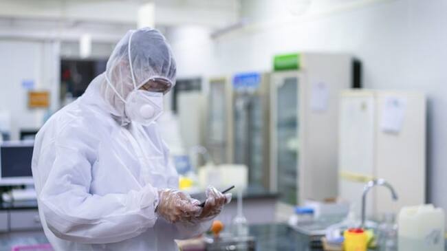 A male doctor works in the bio-nucleic acid laboratory