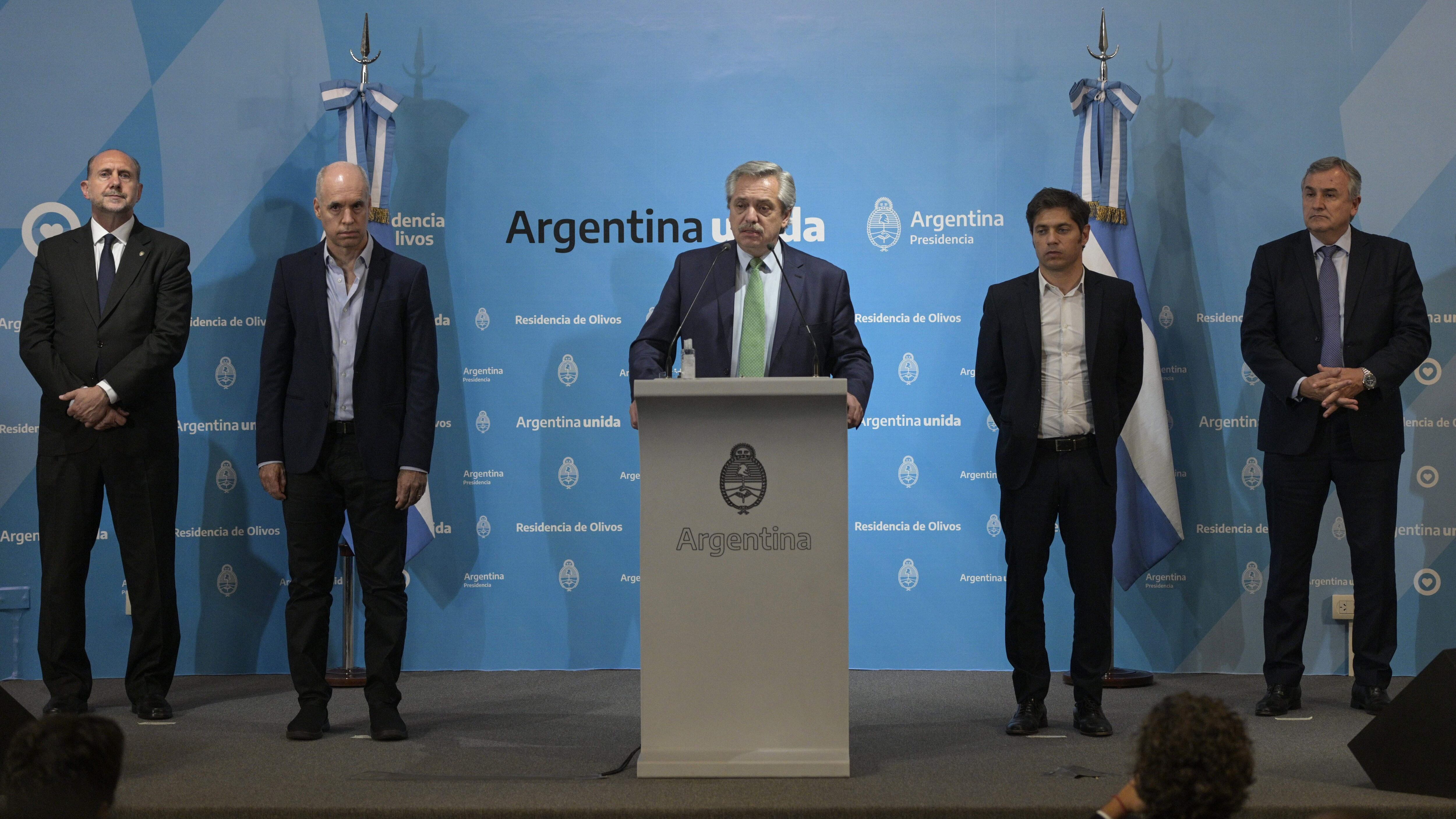 Argentine President Alberto Fernandez (C) talks next to Buenos Aires Mayor Horacio Rodriguez Larreta (2-L), Santa Fe's Governor Omar Perotti (L), Buenos Aires Governor Axel Kicillof (2-R), and Jujuy's Governor Gerardo Morales, in a press conference announcing measures during the outbreak of the new Coronavirus, COVID-19, at Presidential residence in Olivos, Buenos Aires on March 19, 2020. - Argentine President Alberto Fernandez on Thursday announced a "preventative and compulsory" lockdown of the population from Friday to March 31 to stop the spread of the coronavirus pandemic. (Photo by JUAN MABROMATA / AFP) (Photo by JUAN MABROMATA/AFP via Getty Images)